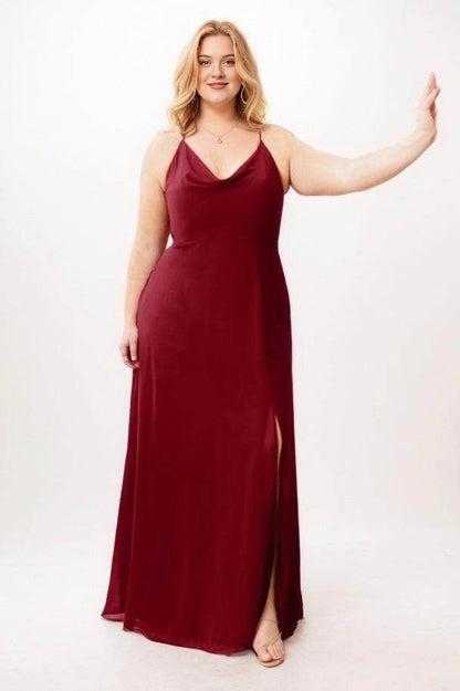 Burgundy velvet A-line bridesmaid dress with a draped cowl neckline, slender straps and a high side slit, front view.