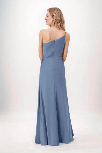 Back view of a Roselledress dusty blue bridesmaid dress with an asymmetric one-shoulder neckline, center-back zipper and gently flared long skirt.