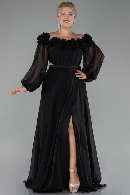 Black plus size A-line wedding guest dress with sheer long sleeves and floral details