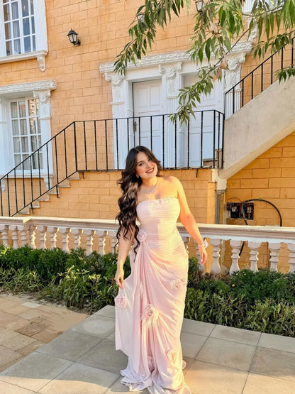 Blush pink plus size strapless chiffon evening dress with ruched bodice and fabric rose details
