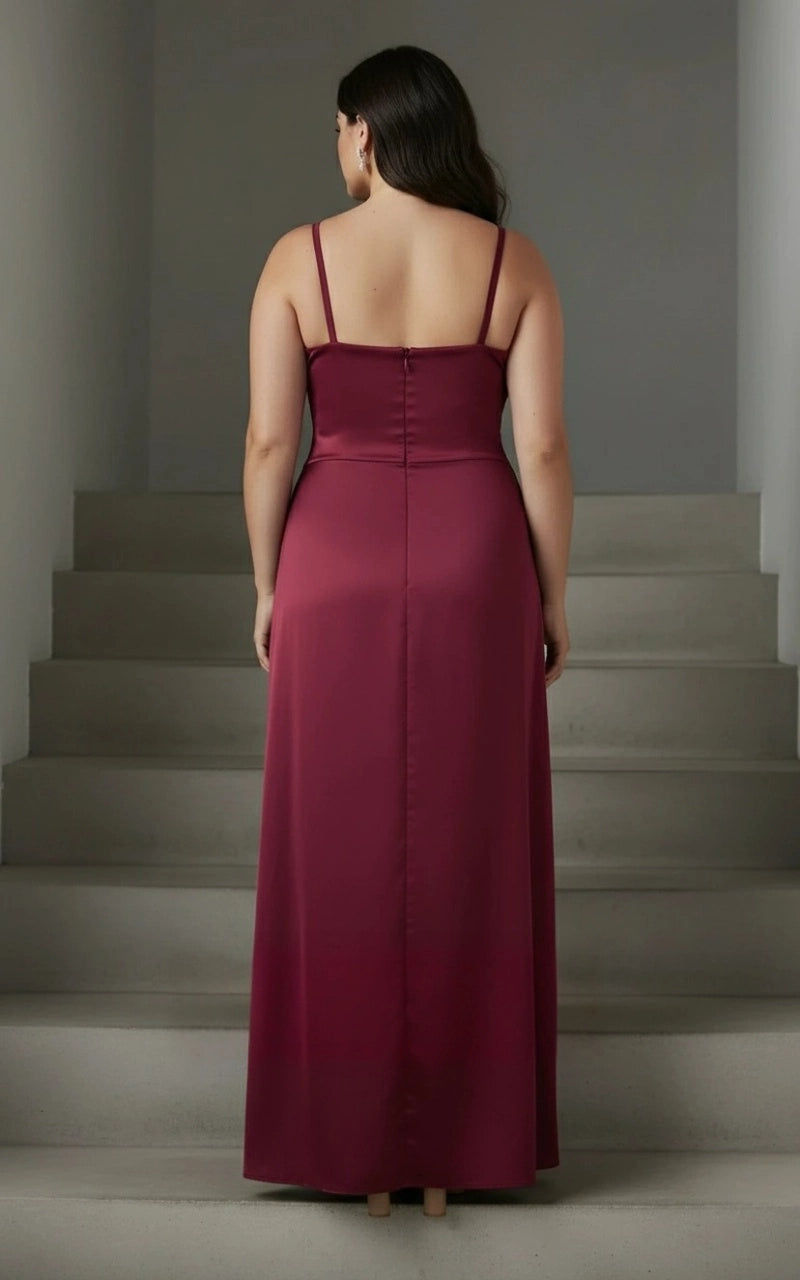 Burgundy plus size wedding guest dress with thin shoulder straps, straight back neckline, center zipper and flowing floor-length column skirt