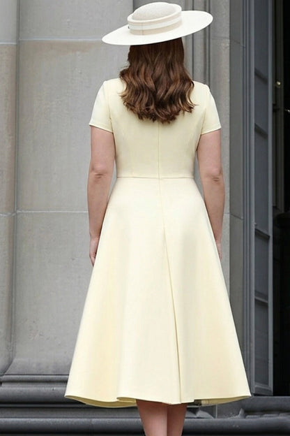 Back view of ivory plus size mother of the bride midi dress featuring a closed back, defined waist and flowing A-line skirt.