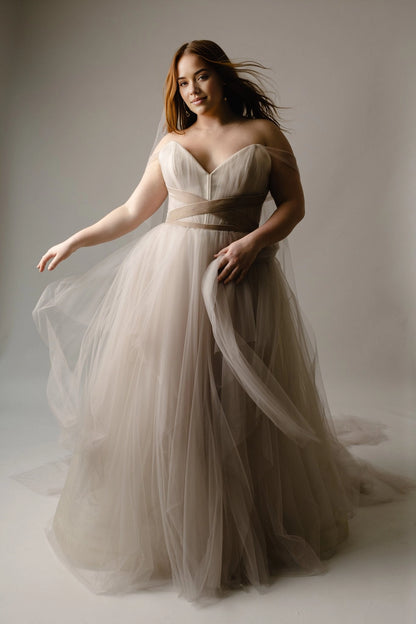 Champagne plus size A-line wedding dress with sweetheart neckline, off-shoulder tulle straps, crisscross waist and layered floor-length skirt