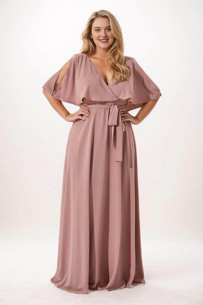 Dusty rose chiffon bridesmaid dress with a crossover V-neck, cape sleeves, shoulder cutouts and a front waist tie, front view.