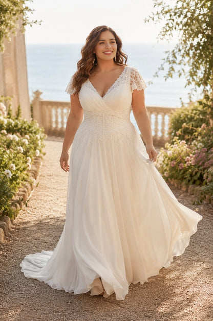 vory plus size A-line wedding dress with V-neck lace bodice, flutter sleeves and flowing skirt.