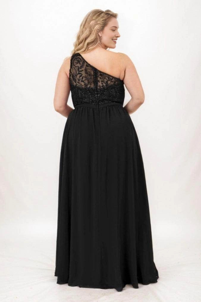 Roselledress black plus size bridesmaid dress with an asymmetric sheer lace back, defined waistband and flowing floor-length skirt, back view.