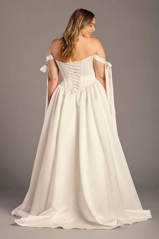 Ivory plus size wedding dress with lace-up corset back, crisscross ribbon closure, off-shoulder bow straps and flowing satin-look skirt