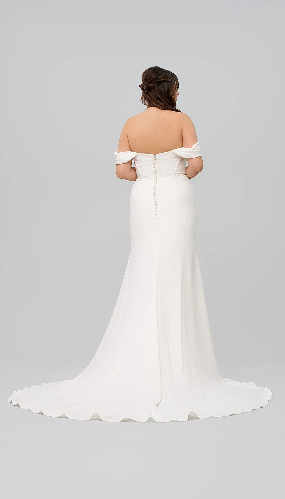 Ivory plus size wedding dress with off-shoulder sleeves, covered button back, fitted mermaid silhouette and flowing sweep train