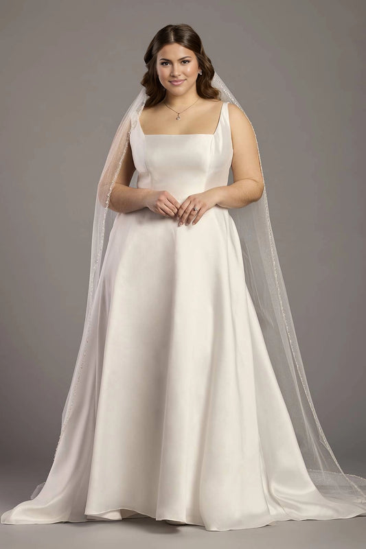 Ivory plus size A-line wedding dress with square neckline, wide shoulder straps, fitted bodice and flowing satin-look floor-length skirt