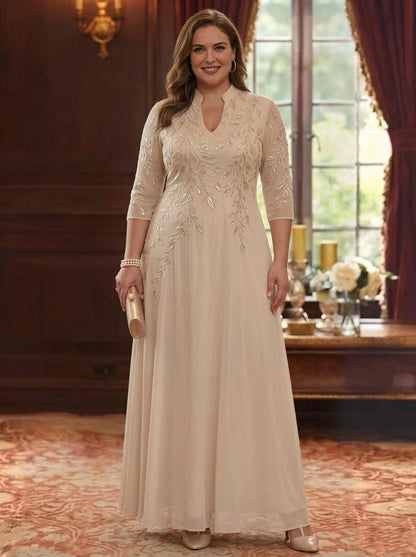 Plus size champagne mother of the bride dress with high neckline, three quarter sleeves, beaded embroidery and flowing A-line skirt by roselledress.