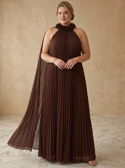 Plus size chocolate brown chiffon halter wedding guest dress with 3D rose trim at neckline, pleated floor length skirt and cape back detail, front view
