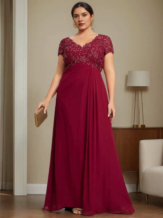 Plus size burgundy chiffon mother of the bride dress with beaded lace V-neck bodice, short sleeves and flowing floor length skirt, front view
