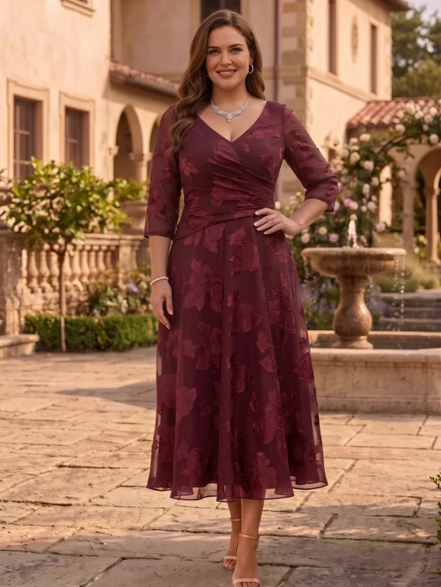 Plus size burgundy mother of the bride dress with V neckline, three quarter sleeves, floral lace texture and A-line midi skirt by roselledress.