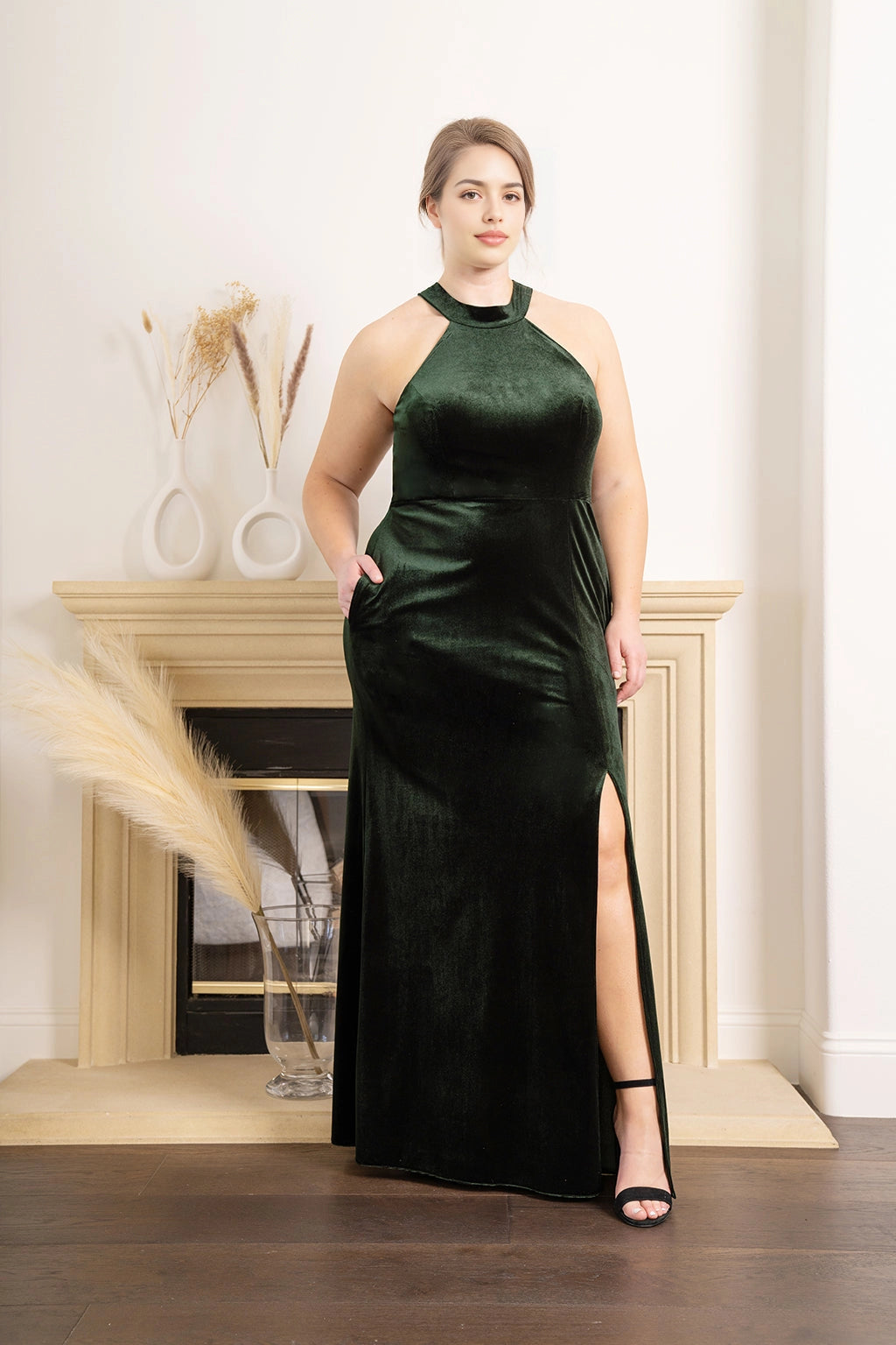Forest green plus size velvet bridesmaid dress with halter neckline, sleeveless A-line silhouette, side pockets and high slit by roselledress