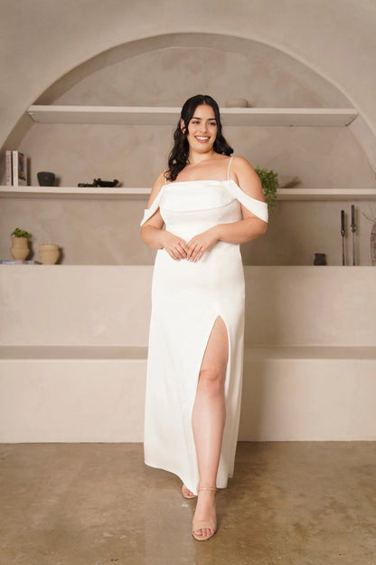 Plus size ivory wedding guest dress with straight neckline, spaghetti straps, off-shoulder sleeves, fitted mermaid silhouette and elegant front slit by roselledress.