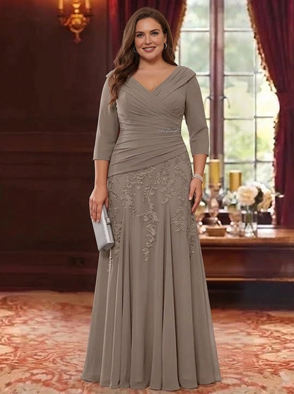 Plus size taupe mother of the bride dress with V-neckline, three quarter sleeves, floral lace embroidery and flowing A-line skirt by roselledress.
