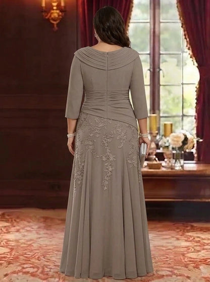 Back view of plus size taupe mother of the bride dress featuring three quarter sleeves, lace embroidery and center back zipper closure.