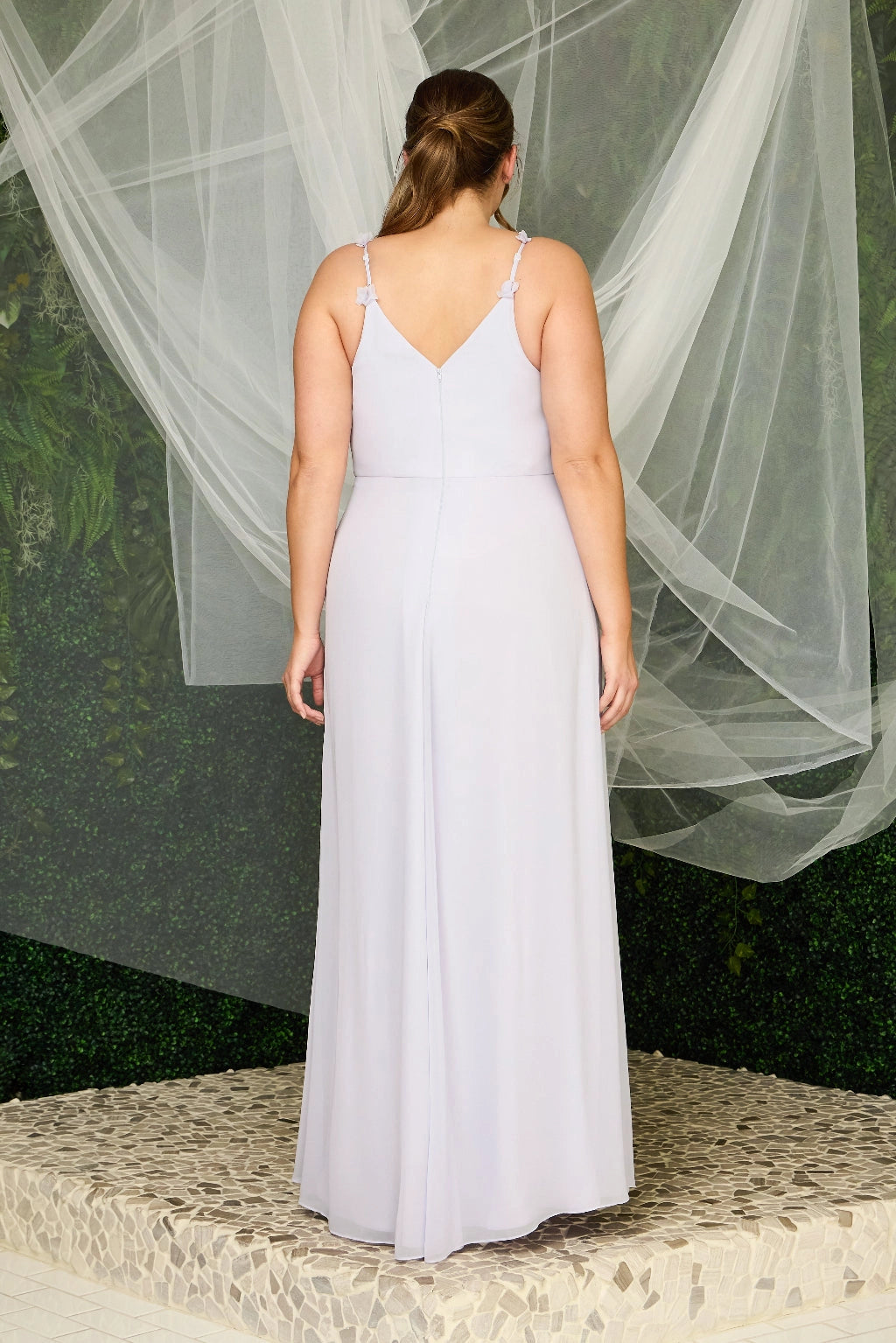 Back view of light lavender plus size bridesmaid dress featuring floral straps, V-shaped back, center zipper and flowing A-line skirt by roselledress