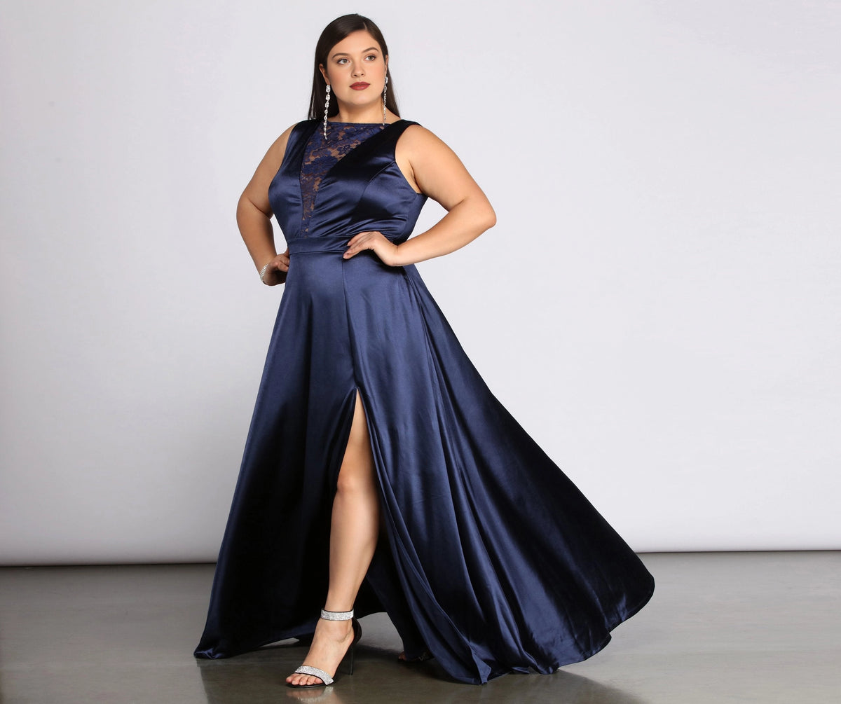 Plus size navy blue satin A-line wedding guest dress with lace illusion V-neck, sleeveless, fitted waist and front high slit, front view
