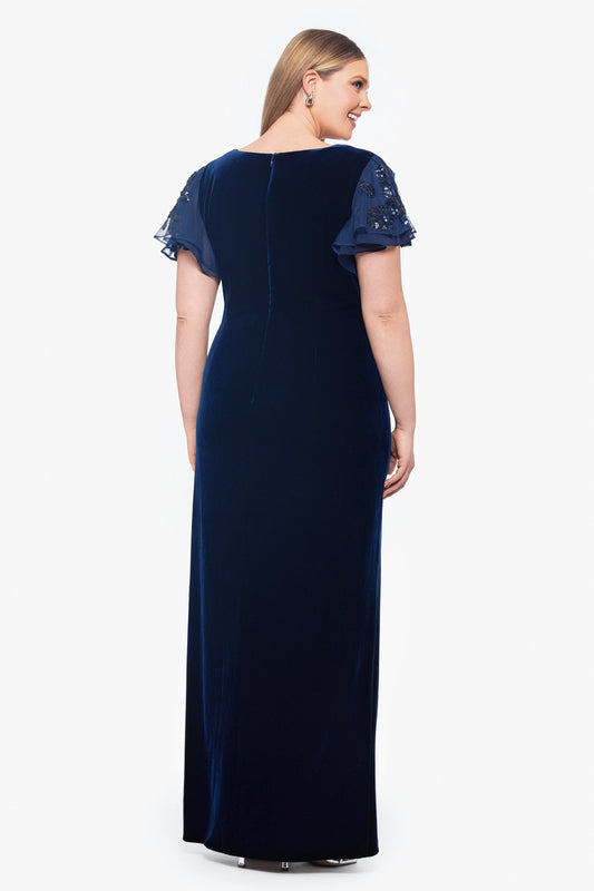 Back view of navy blue plus size mother of the bride dress featuring sheer sequin sleeves, closed back, center zipper and velvet maxi skirt by roselledress