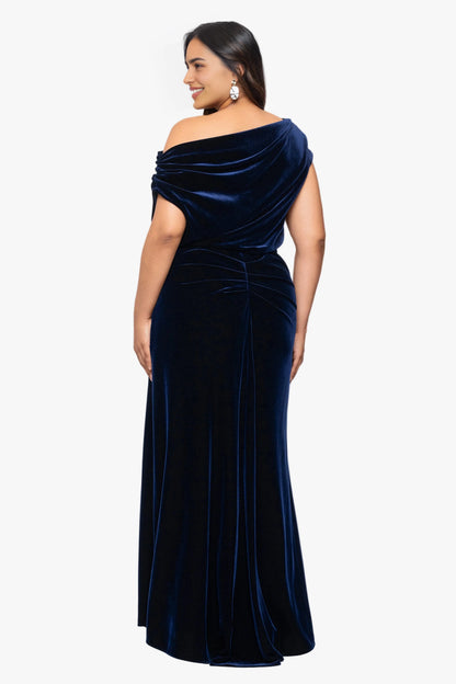Back view of navy blue plus size velvet wedding guest dress featuring asymmetric draped neckline, gathered waist and flowing maxi skirt by roselledress