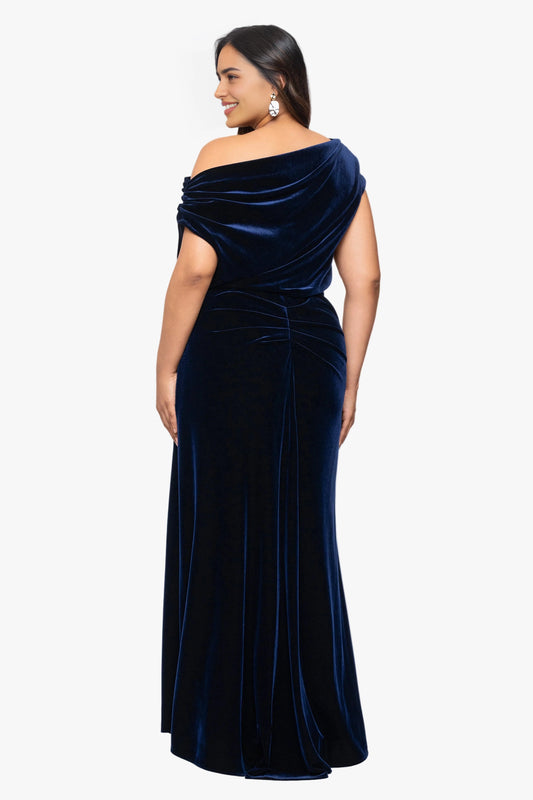 Back view of navy blue plus size velvet wedding guest dress featuring asymmetric draped neckline, gathered waist and flowing maxi skirt by roselledress