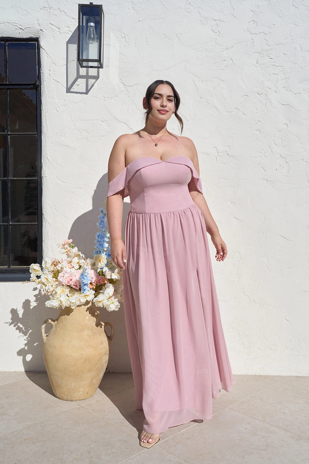 Plus size dusty rose A-line bridesmaid dress with sweetheart neckline, off-shoulder sleeves, fitted bodice and flowing floor-length skirt by roselledress.
