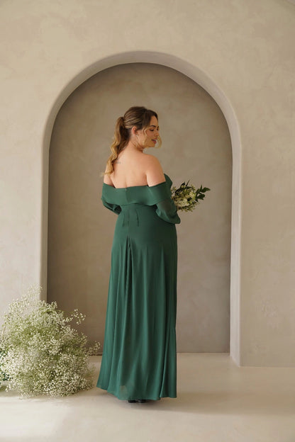 Back view of forest green plus size bridesmaid dress featuring an off shoulder straight neckline, center zipper and flowing skirt by roselledress