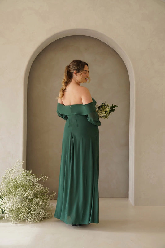 Back view of forest green plus size bridesmaid dress featuring an off shoulder straight neckline, center zipper and flowing skirt by roselledress