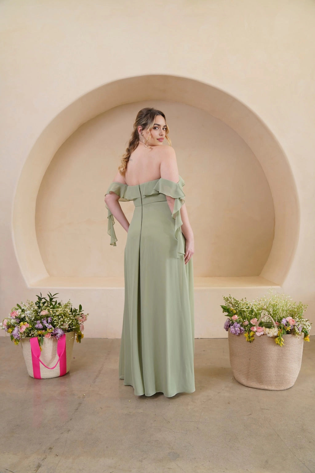 Back view of sage green plus size bridesmaid dress with cascading ruffle sleeves, straight back neckline and concealed zipper by roselledress