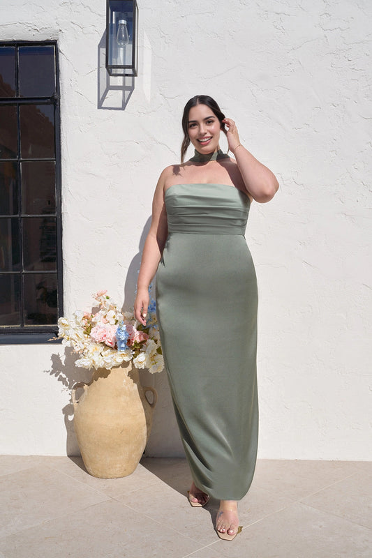 Plus size sage green bridesmaid dress with strapless straight neckline, ruched bodice, matching neck scarf and floor-length sheath silhouette by roselledress.