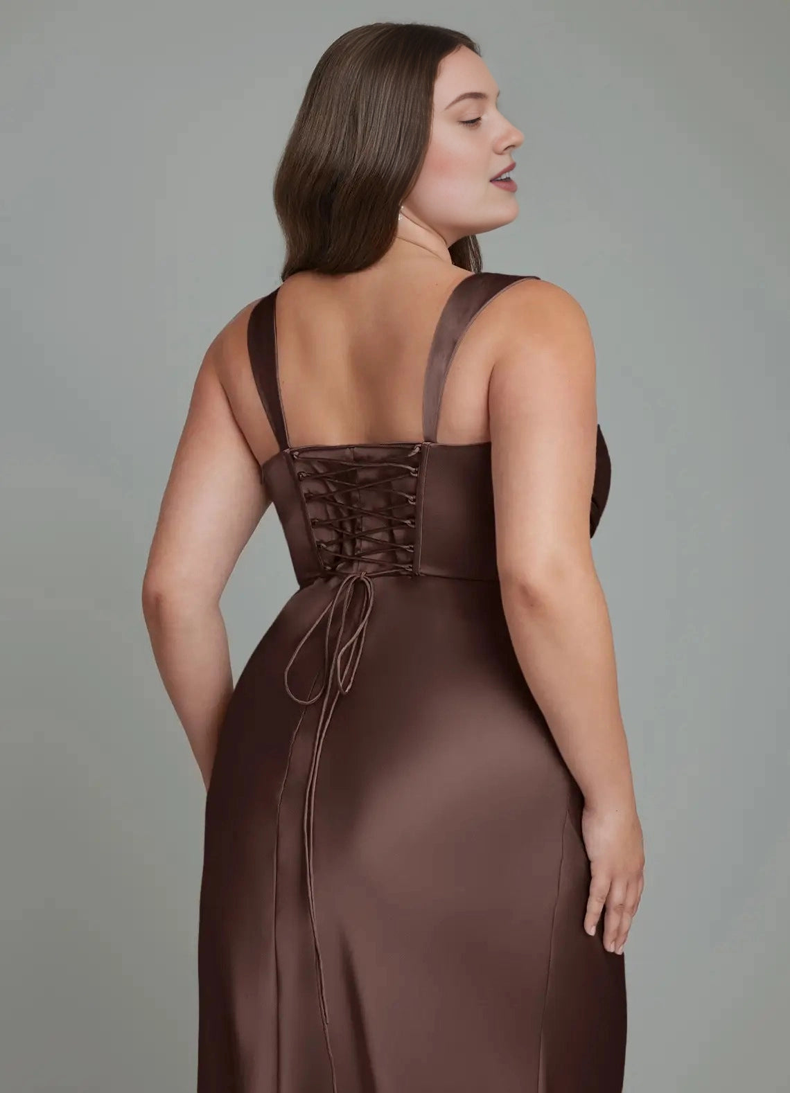 Back view of plus size brown bridesmaid dress featuring corset lace-up back, adjustable tie detail and elegant mermaid silhouette.