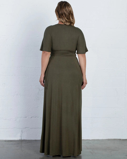 Back view of plus size dark olive green mother of the bride dress featuring a high closed back, short flutter sleeves, wide waistband and flowing maxi skirt by roselledress.