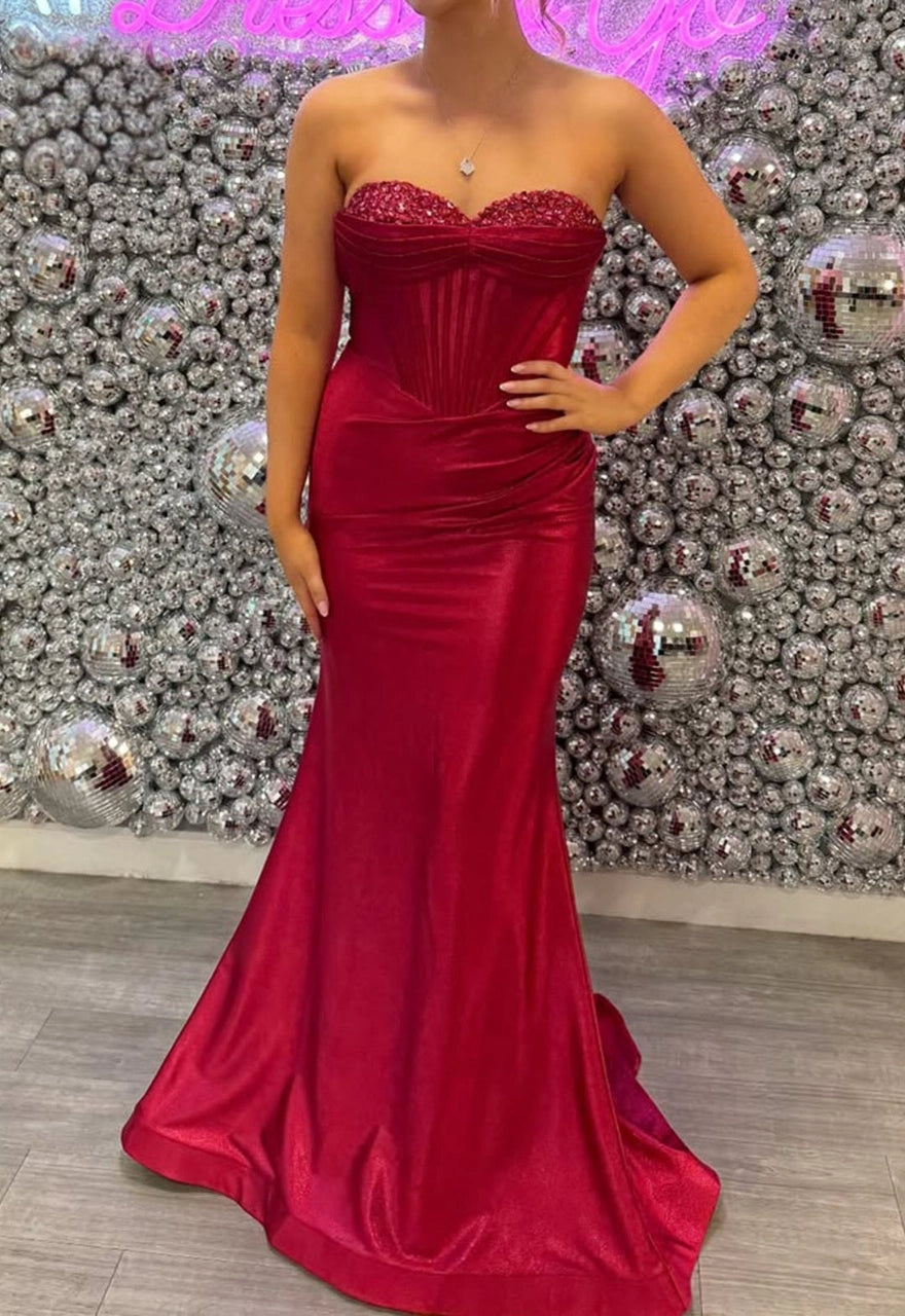 Red plus size strapless satin mermaid evening dress with beaded bust and corset bodice
