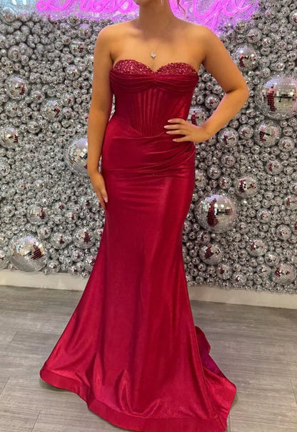 Red plus size strapless satin mermaid evening dress with beaded bust and corset bodice

