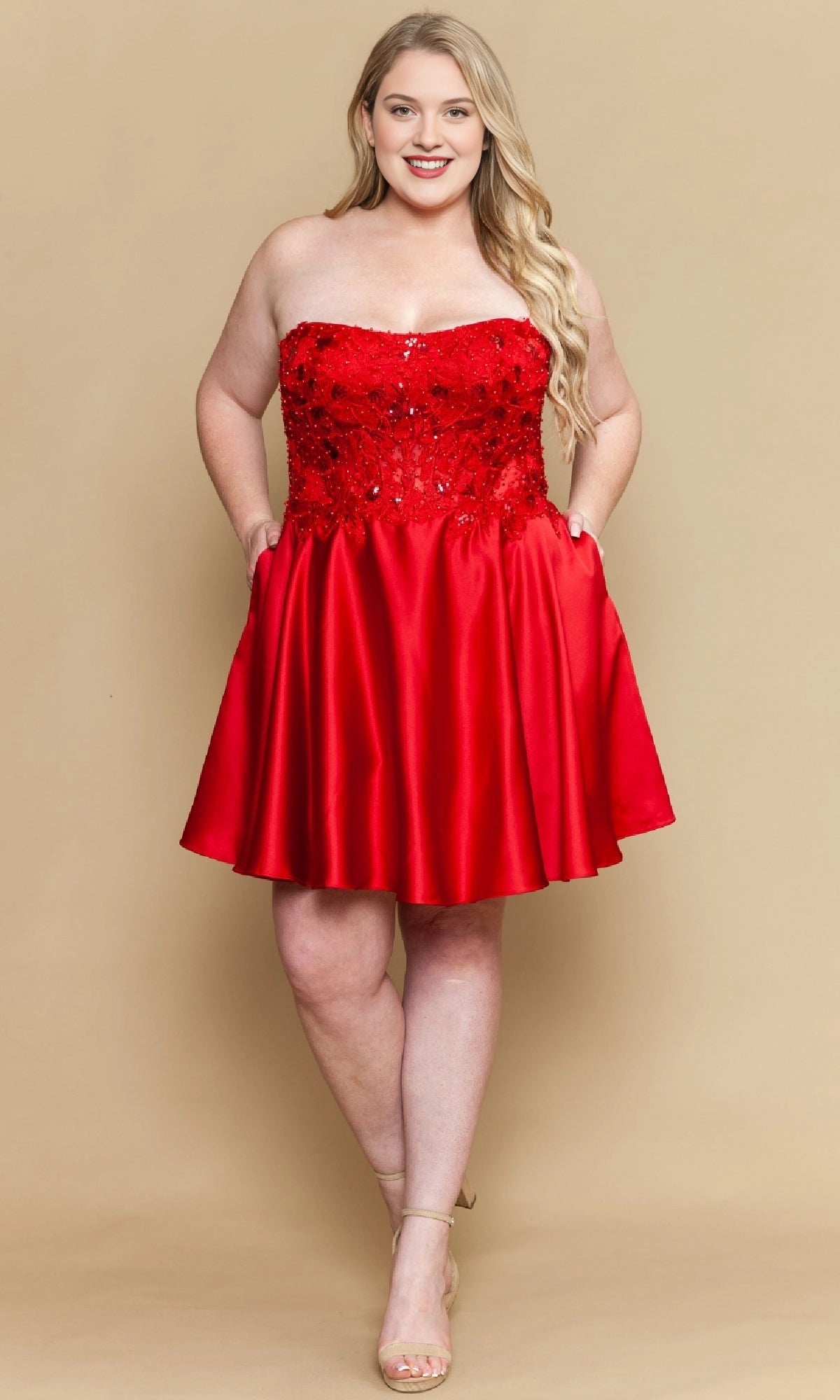 Red plus size strapless homecoming dress with lace sequin bodice, satin skirt and side pockets