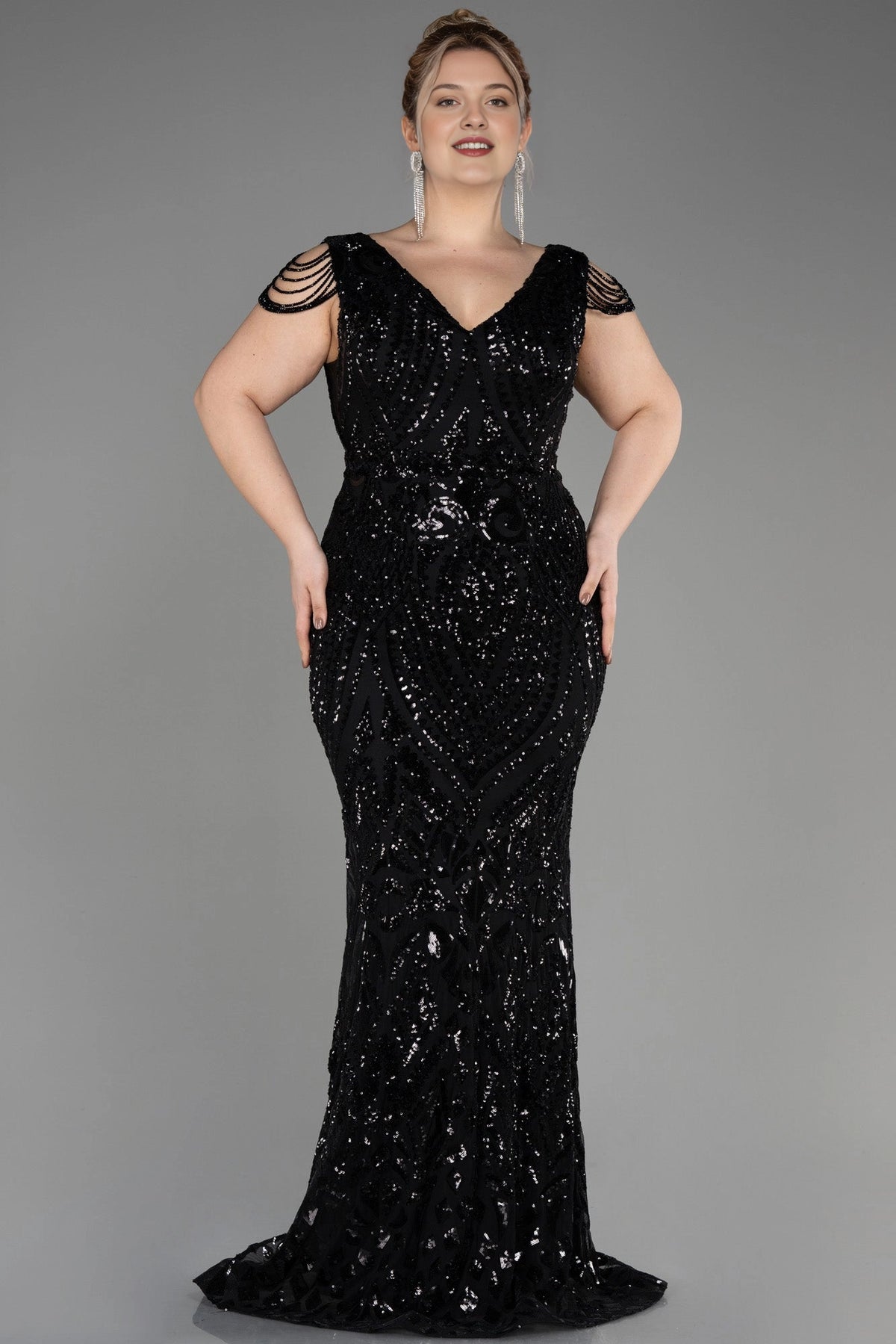 Front view of a roselledress plus size black sequin V neck beaded cap sleeve long evening dress