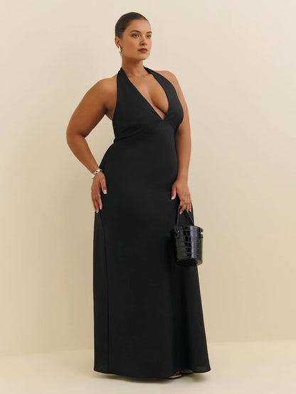 Roselle Dress plus size black wedding guest dress, halter deep v‑neck, flowy maxi formal gown front view