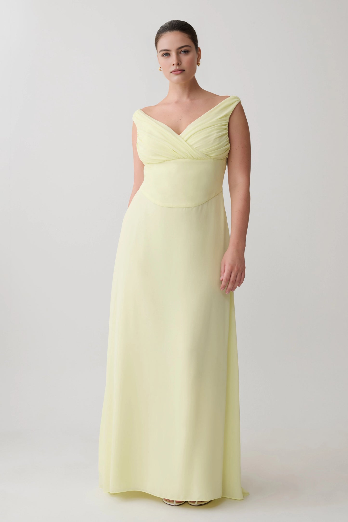 Roselle Dress plus size pale yellow wedding guest dress, off‑the‑shoulder v‑neck, ruched chiffon floor‑length gown front view