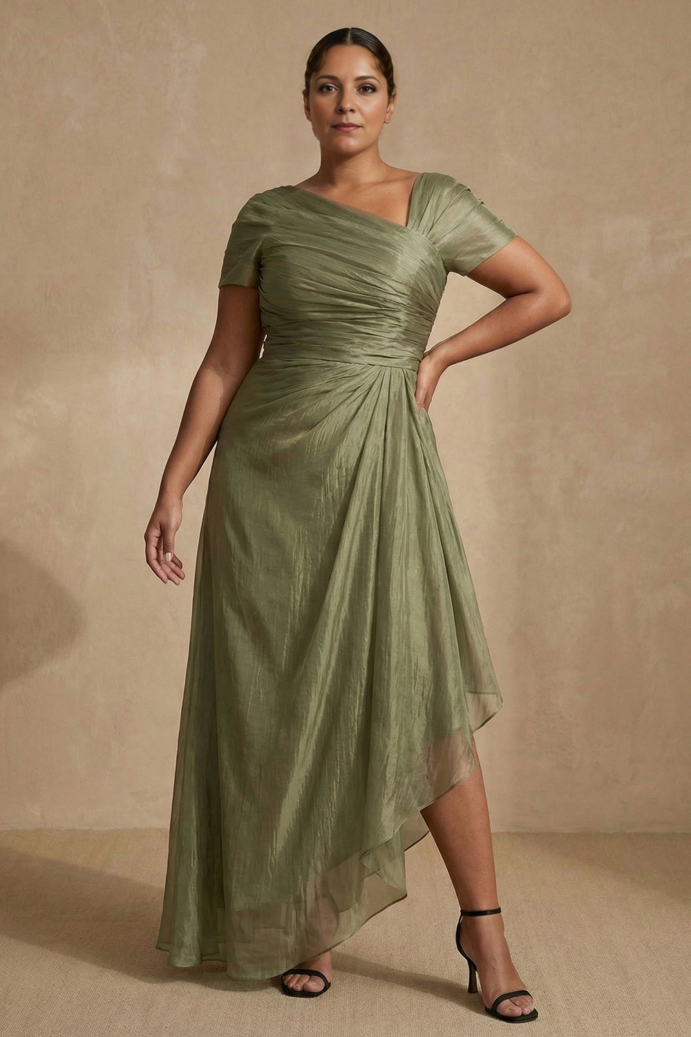Sage green plus size mother of the bride dress with V-neck, ruched bodice and high-low hem