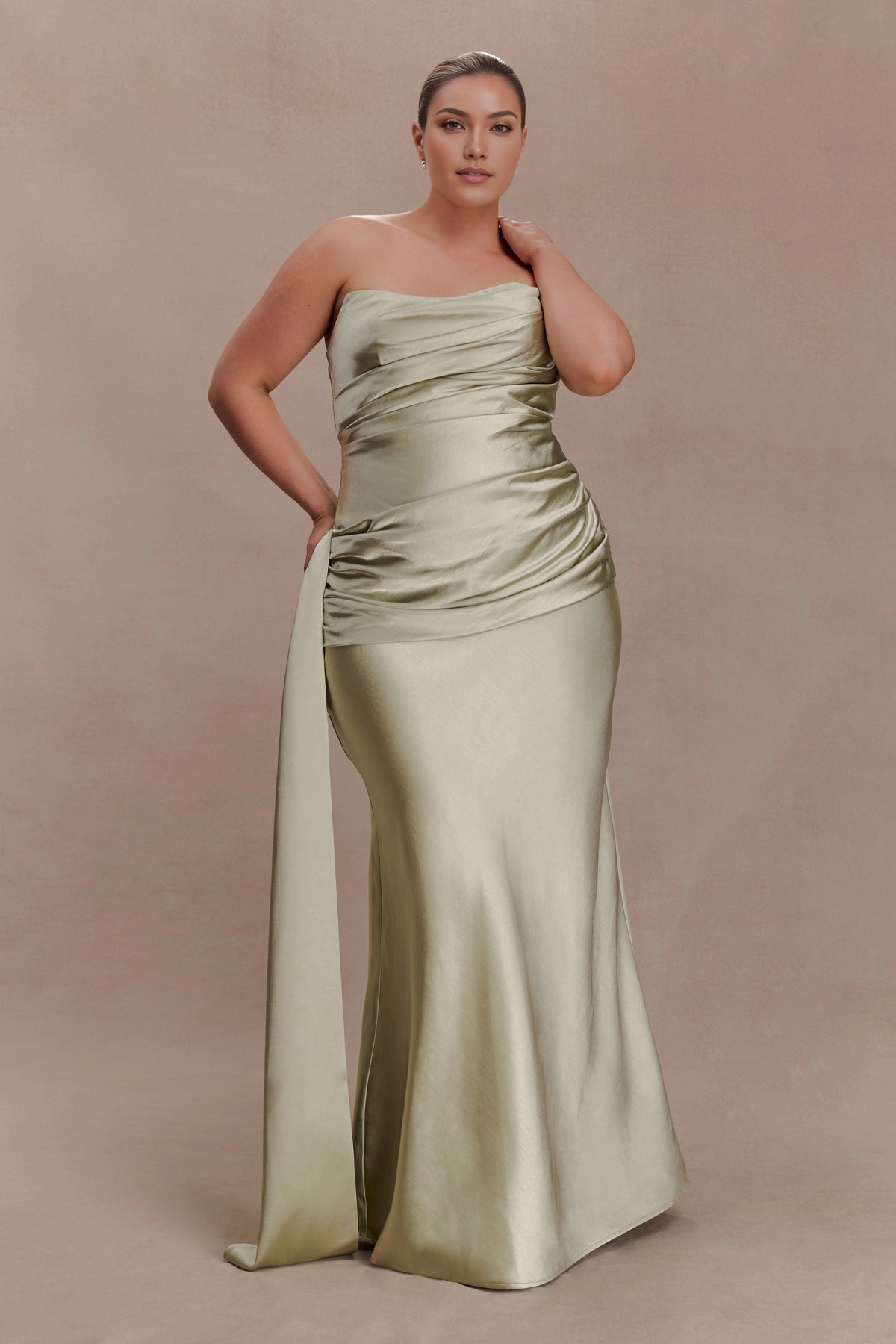 Sage green plus size mermaid evening dress with strapless neckline, ruched satin-look bodice, fitted silhouette and long side sash front view