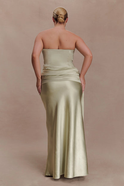 Sage green plus size strapless evening dress with straight back neckline, ruched waist, fitted hips and floor-length mermaid skirt back view