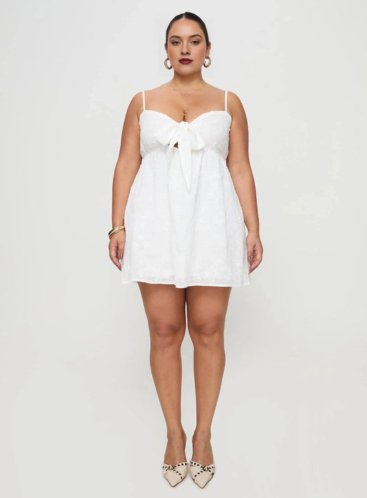 White plus size sweetheart babydoll homecoming dress with bow tie bust and flowy chiffon skirt
